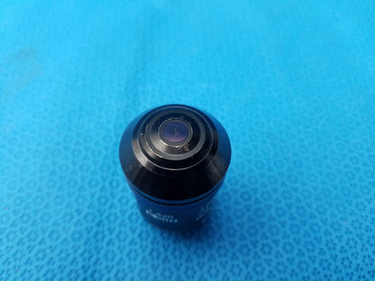 Black glossy Olympus UPlanSApo 60x microscope objective with concentric rings featuring numerical aperture 1.35 and field number 26.5