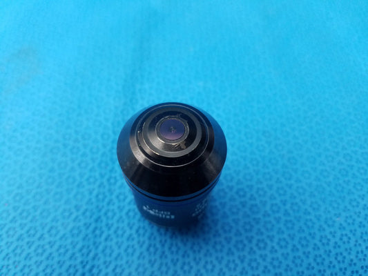Black glossy Olympus UPlanSApo 60x microscope objective with concentric rings featuring numerical aperture 1.35 and field number 26.5