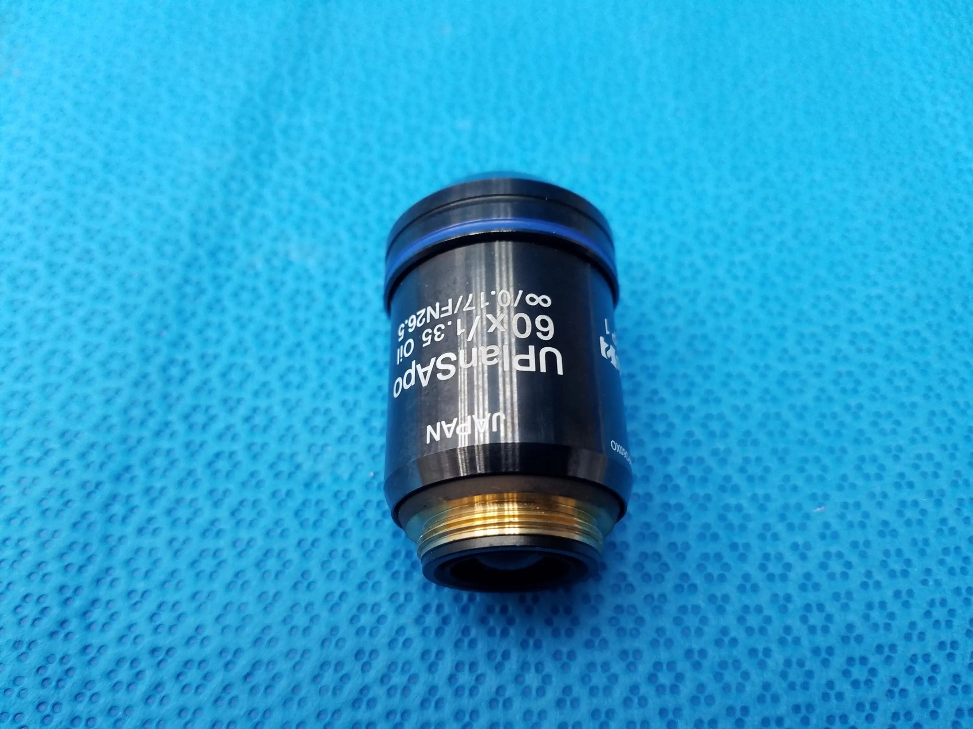 Olympus UPlanSApo 60x microscope objective with numerical aperture 1.35 and field number 26.5 gold threaded base