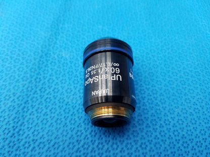 Olympus UPlanSApo 60x microscope objective with numerical aperture 1.35 and field number 26.5 gold threaded base