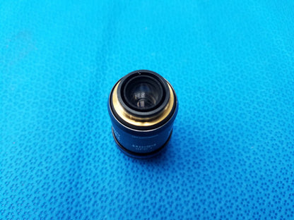 Olympus UPlanSApo 60x microscope objective lens in black and gold matte finish with numerical aperture 1.35 and field number 26.5