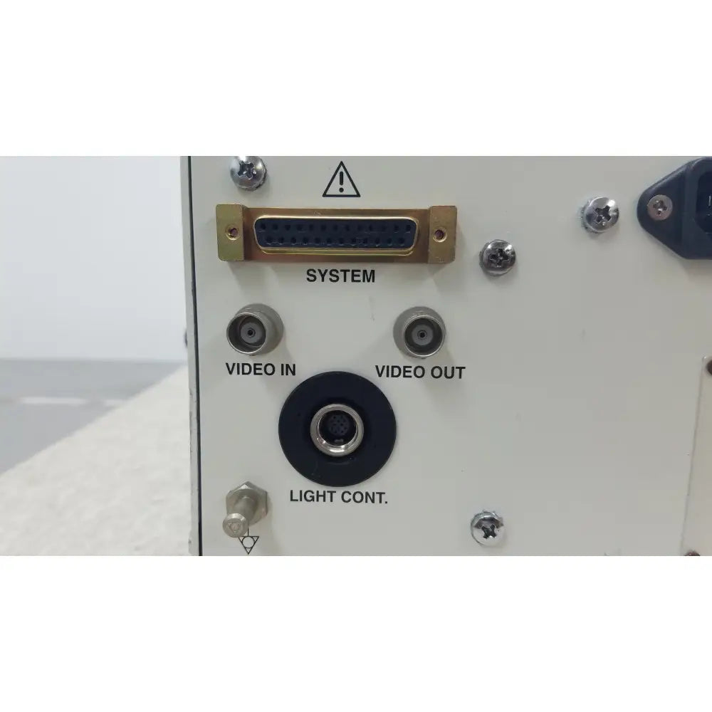 Back side of olympus visera clv-s40 emergency lamp with white panel gold d-sub connector and silver video jacks