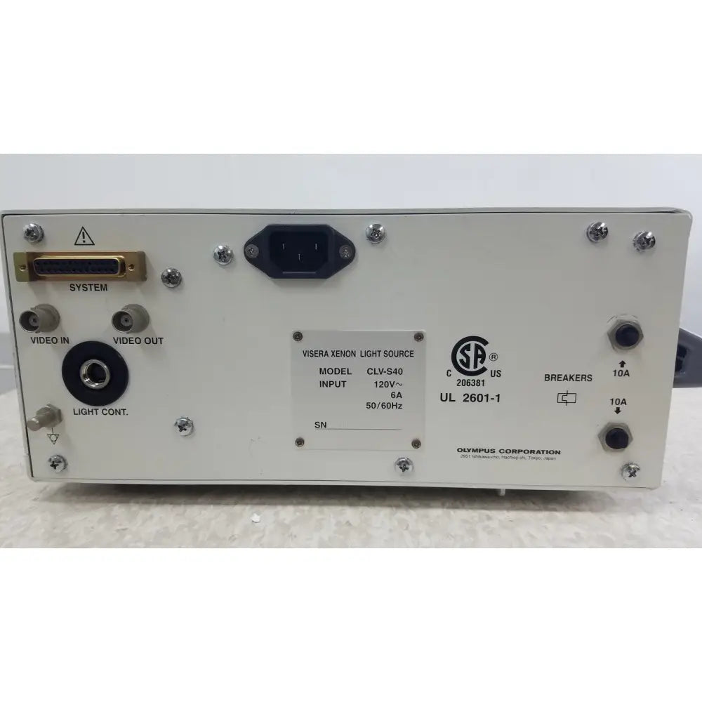 White rectangular olympus visera clv-s40 emergency lamp with xenon light source featuring gold video input port and black power connector