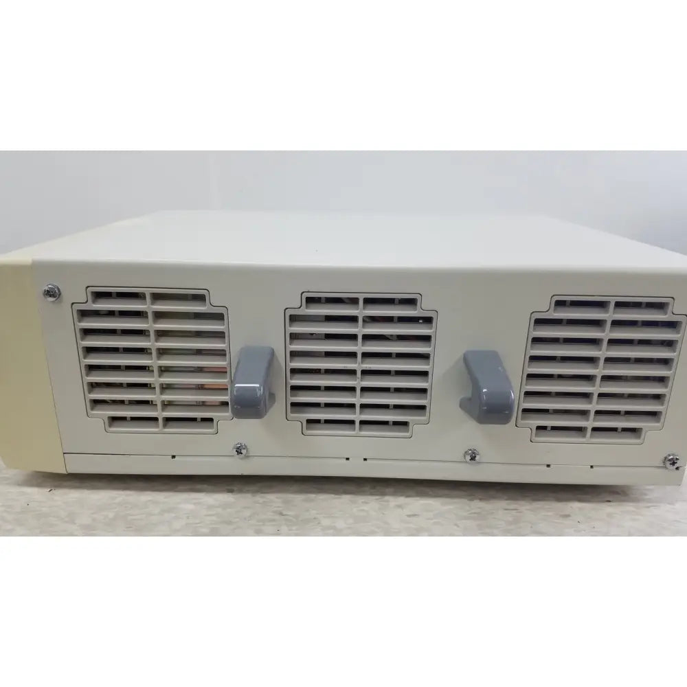 Beige and gray industrial power supply unit with ventilation grilles and handles for olympus visera clv-s40 emergency lamp