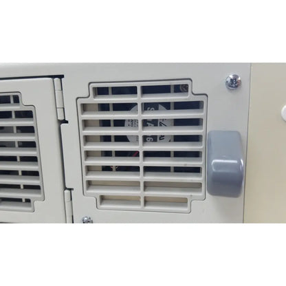 Gray plastic handle on a white ventilation grille of the olympus visera clv-s40 emergency lamp for medical use