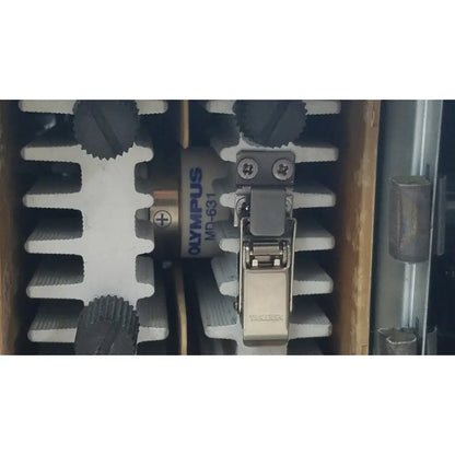 Olympus visera clv-s40 emergency lamp camera module with silver metal latch and black gear components for precise operation