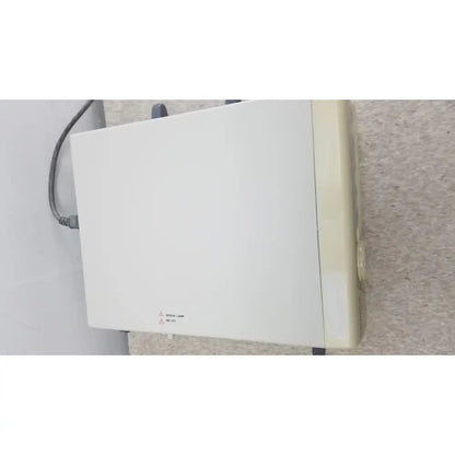 White rectangular olympus visera clv-s40 emergency lamp with beige side panel and gray power cord attached