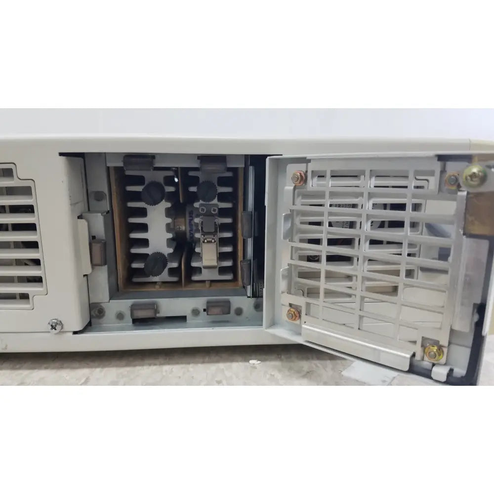 White industrial-grade electrical switchgear cabinet with open doors showing internal components for olympus visera clv-s40 emergency lamp