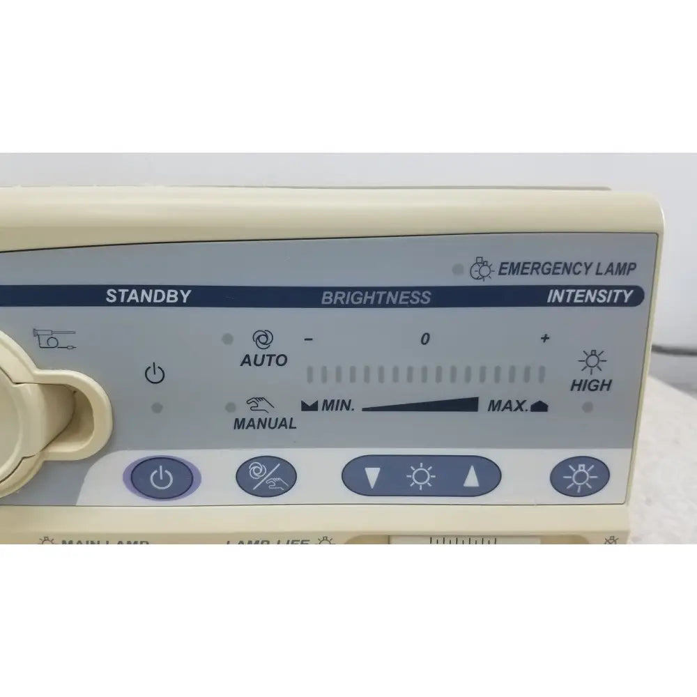 Beige medical-grade control panel with blue-labeled dials for brightness and emergency functions on olympus visera clv-s40 emergency lamp