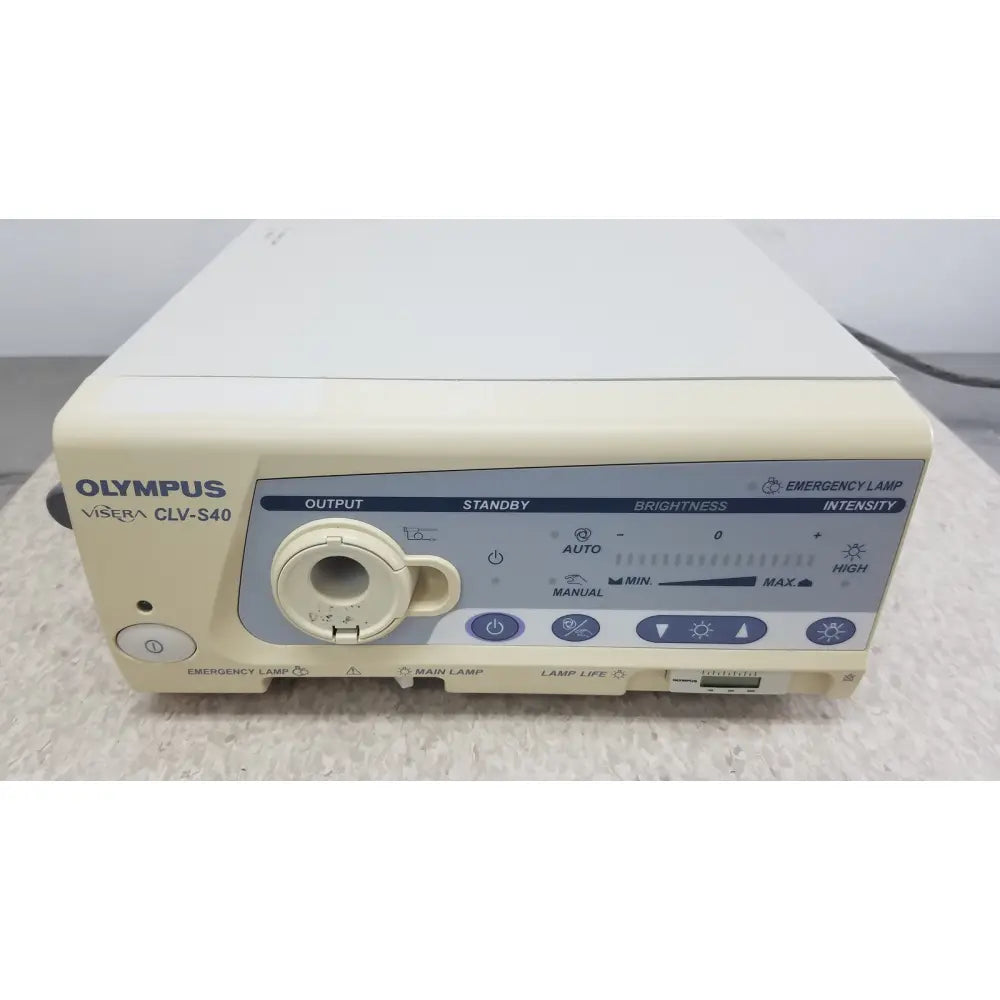 Cream-colored olympus visera clv-s40 emergency lamp control unit with circular output port and multiple function buttons