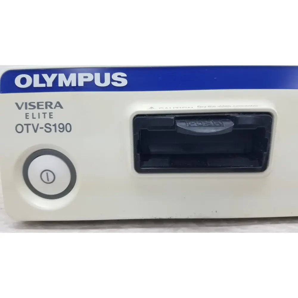 White and blue olympus visera elite otv-s190 video system with circular power button and black push card slot visible