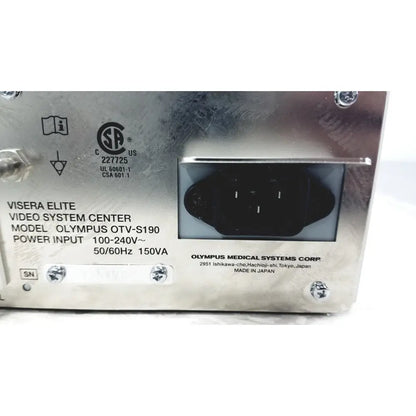Silver metallic back panel of olympus visera elite video system otv-s190 with black power input socket and specifications label