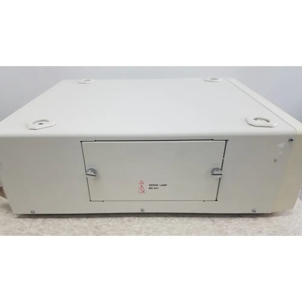 White rectangular xenon lamp with silver latches labeled xenon lamp md-631 for olympus visera elite xenon light source