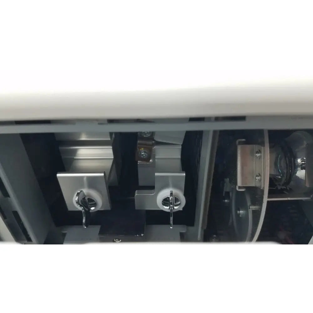 Silver metallic key switches with circular knobs and chrome levers in gray housing of olympus visera elite xenon light source