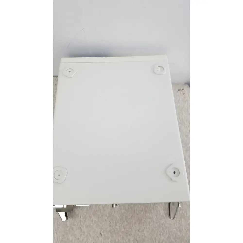 White rectangular plastic box with metal feet and mounting holes on the back of olympus visera elite xenon clv-s190 light source