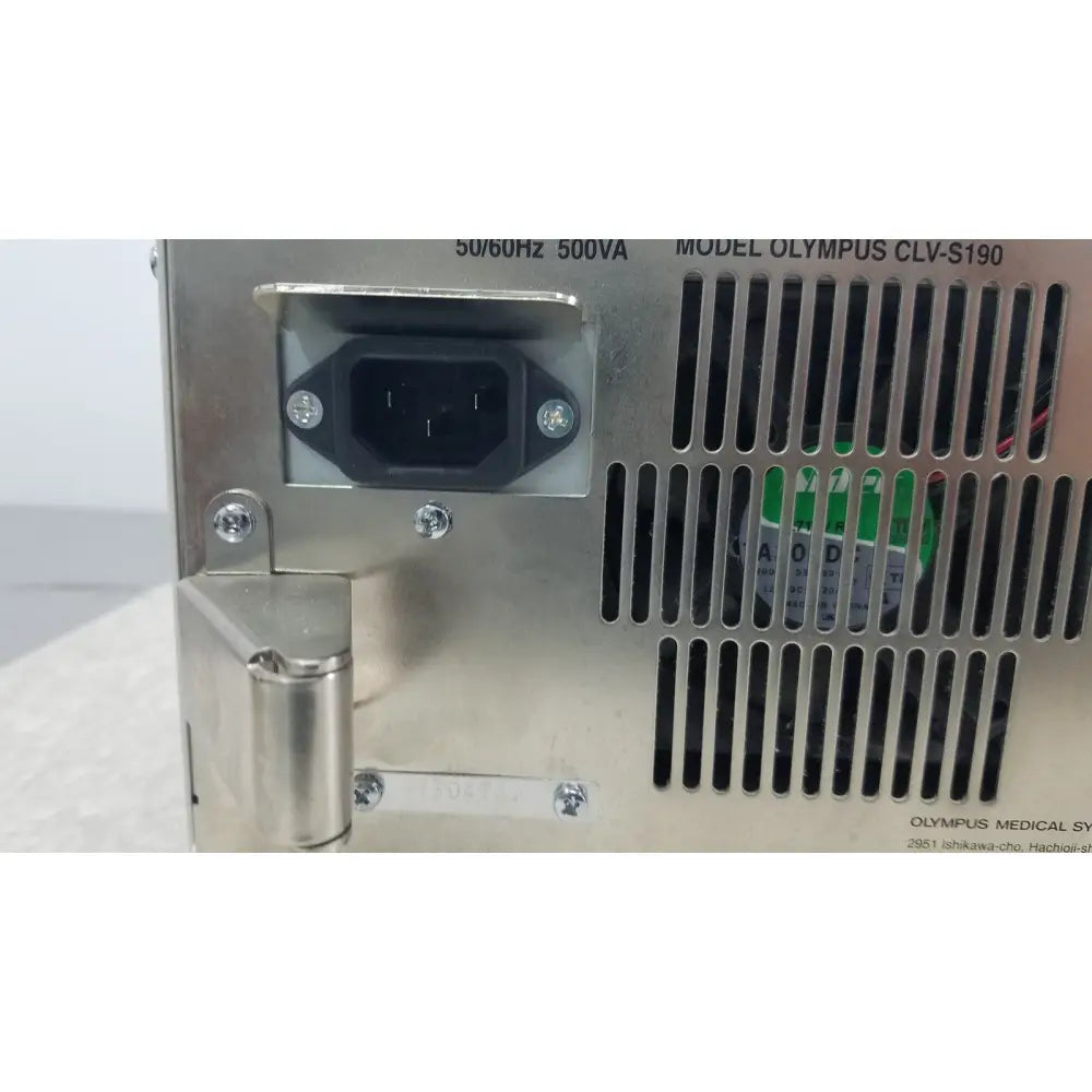 Silver metallic olympus visera elite xenon clv-s190 light source showing black power input port and vertical ventilation slats