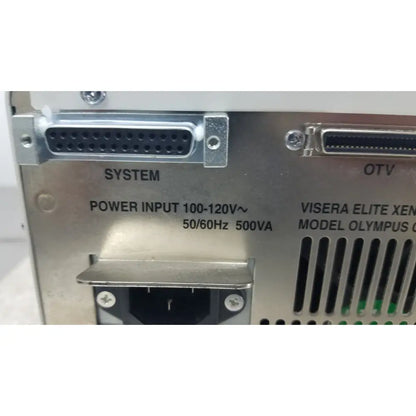 Back side of silver metallic olympus visera elite xenon clv-s190 light source with labeled system and otv ports and power specs