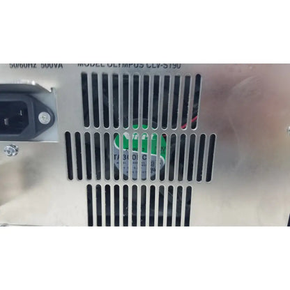 Silver metallic olympus visera elite xenon clv-st90 power supply with vertical slotted ventilation and black ac input plug