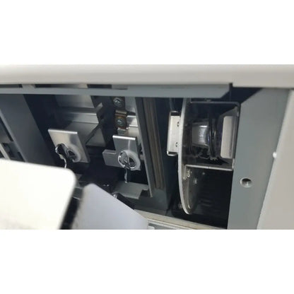Silver-toned mechanical key locks with metallic levers inside gray industrial cabinet of olympus visera elite xenon light source