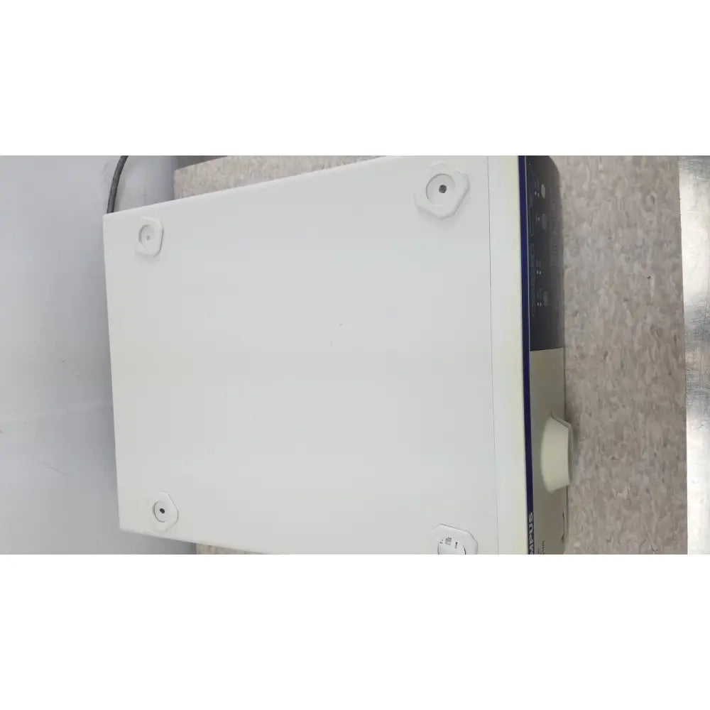 White rectangular laboratory equipment with black beige front panel branded shimadzu for olympus visera elite xenon light source