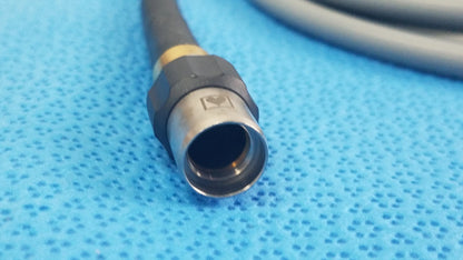 Olympus wa03200a black and gold fiber optic light cable connector with metallic hexagonal housing for medical equipment reuse
