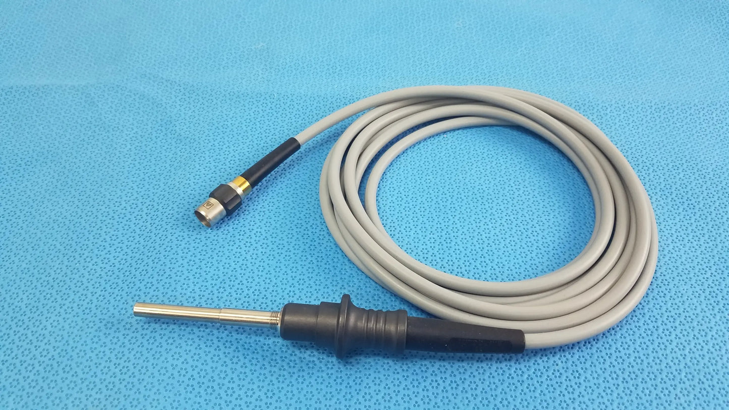 Gray coiled olympus wa03200a s fiber optic light cable with black handle, metallic probe tip, and gold connector for medical equipment