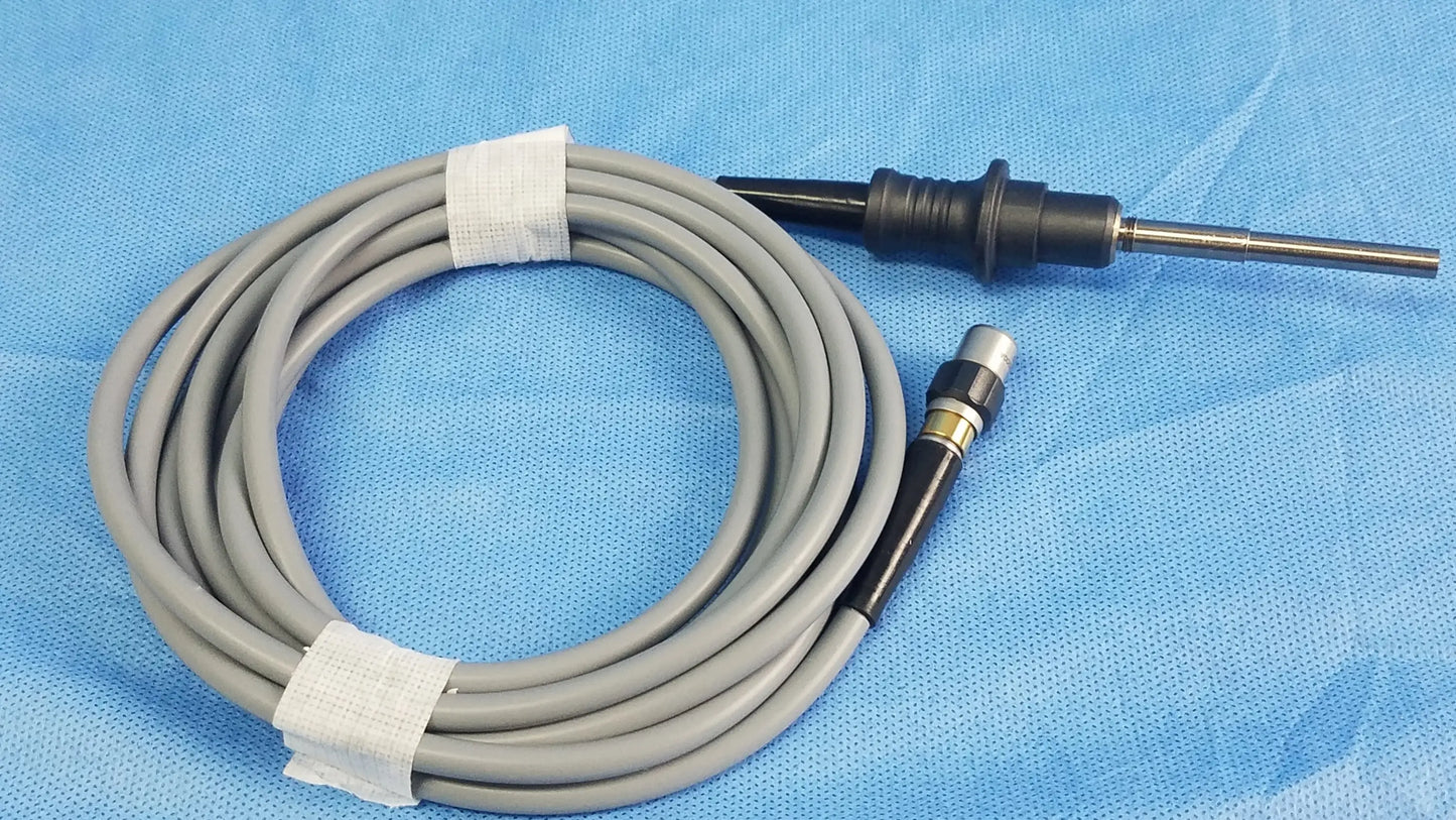 Gray coiled Olympus WA03200A S fiber optic light cable with black and metallic connectors for medical endoscope use