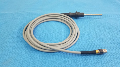 Gray coiled olympus wa03200a s fiber optic light cable with black and metallic connectors for reuse medical equipment