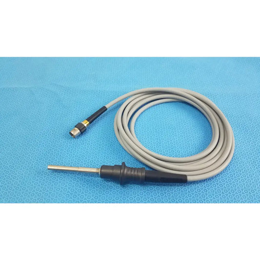Gray coiled olympus wa03200a s fiber optic light cable with black handle, metallic probe tip, and gold connector for medical equipment
