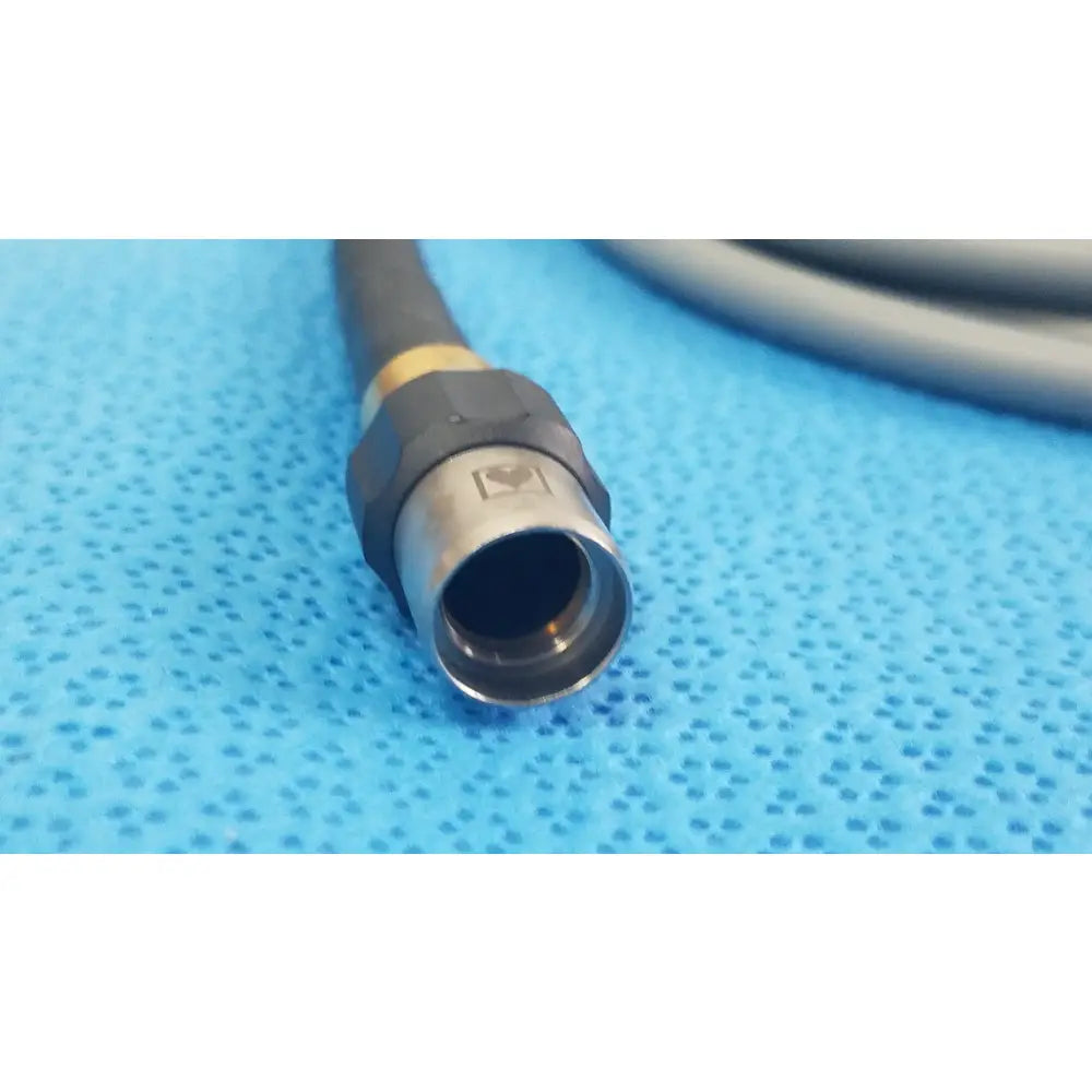Olympus wa03200a black and gold fiber optic light cable connector with metallic hexagonal housing for medical equipment reuse