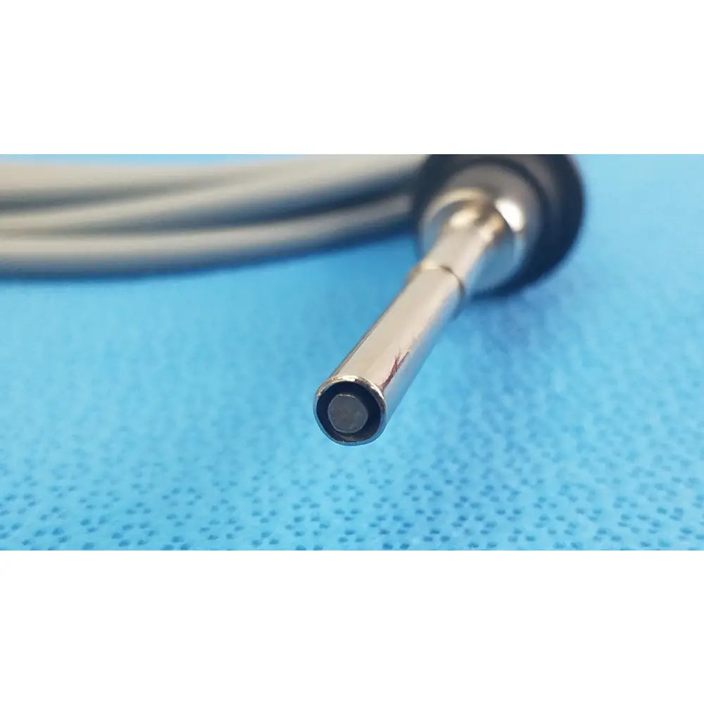 Silver-tipped olympus wa03200a s fiber optic light cable with black rubberized grip and coiled gray cable for medical equipment