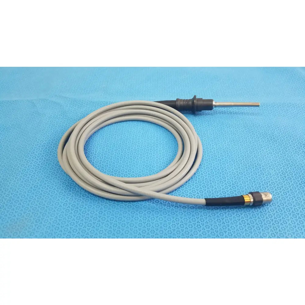 Gray coiled olympus wa03200a s fiber optic light cable with black and metallic connectors for reuse medical equipment