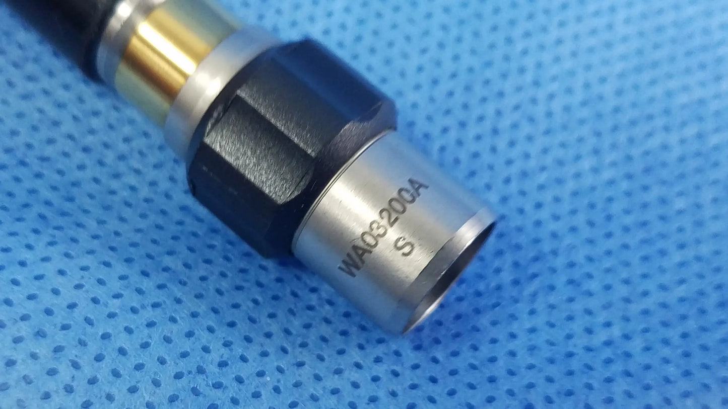 Silver metallic fiber optic light cable connector with black and gold accents engraved model number wa03200a for Olympus
