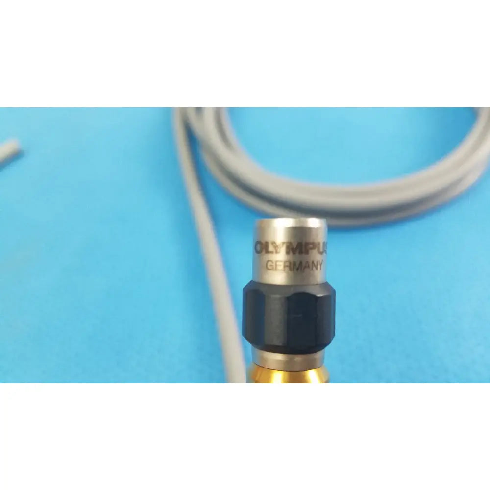 Olympus wa03300a light guide featuring a metallic sensor head with black hexagonal collar and gold base for medical equipment