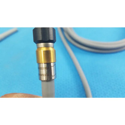 Black gold and silver industrial pressure gauge with textured grip for medical equipment olympus wa03300a light guide cable