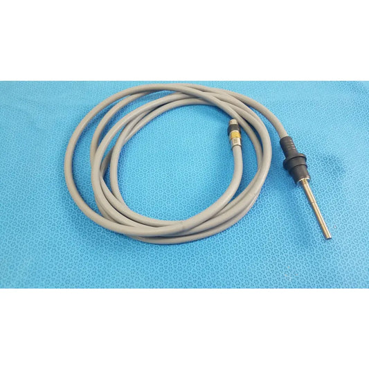 Gray coiled medical equipment cable with black metallic connector for olympus wa03300a light guide use