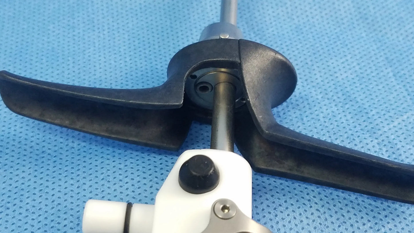 Black ergonomic handle with white and metallic components of olympus wa22067a passive monopolar working element