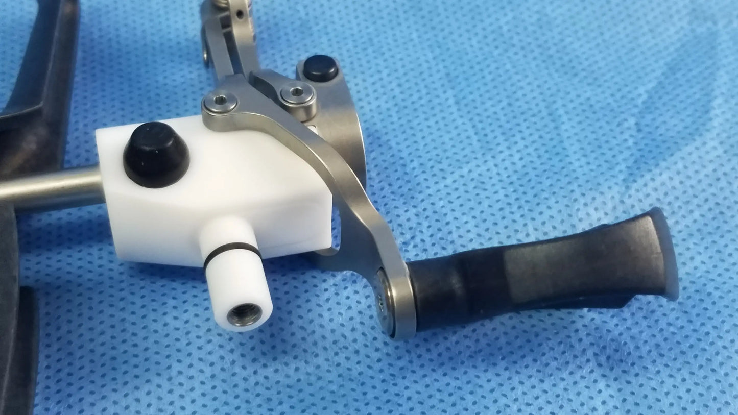 Olympus WA22067A passive monopolar working element with white plastic body, metallic arm, and black rubberized grip