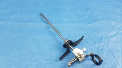Silver surgical monopolar working element with black ergonomic handles and white central passive monopolar working component