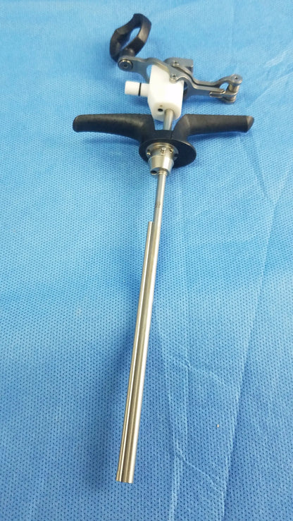 Silver surgical monopolar working element with black ergonomic handles and white plastic component for passive use