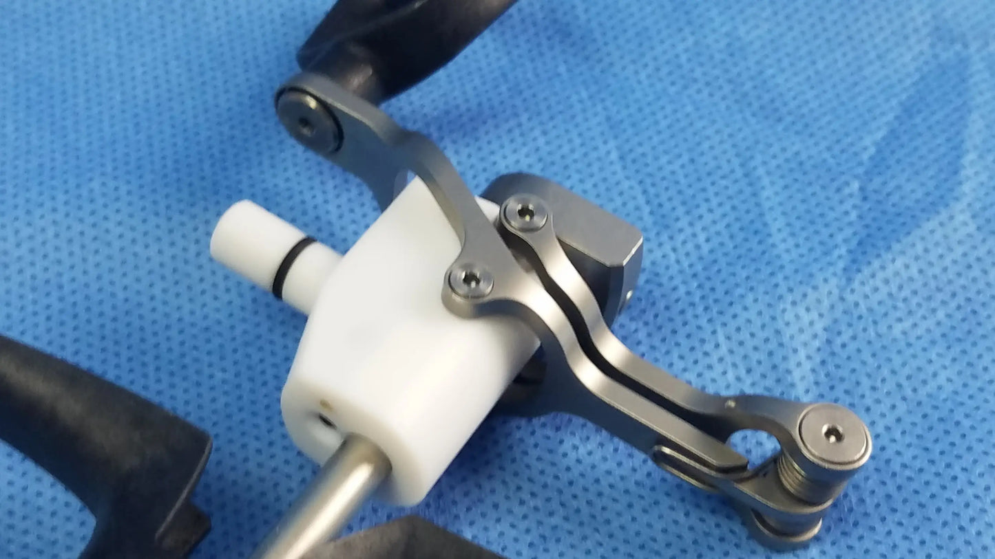 Silver-toned metal passive monopolar working element with white plastic handle and black grip for surgical use