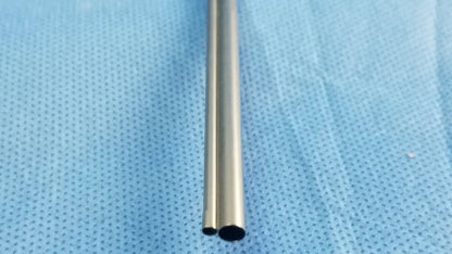A sleek metallic silver passive monopolar working element with polished cylindrical tube for surgical use olympus wa22067a