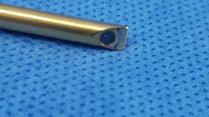 Gold-colored metal oes elite wa2t470a rigid telescope with rounded tip and dark blue circular component at the end