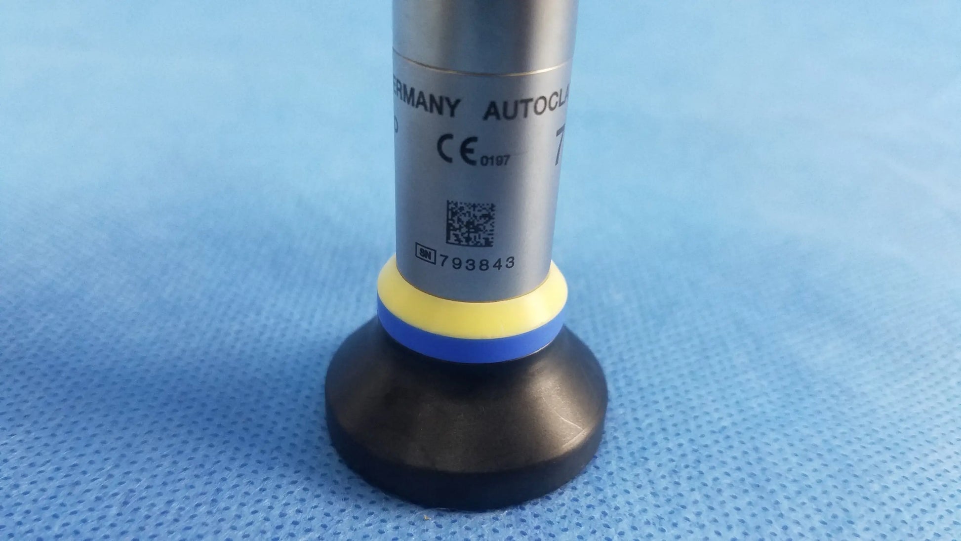 Silver cylindrical autoclave with black base and yellow blue ring labeled germany autoc for wa2t470a oes elite rigid telescope