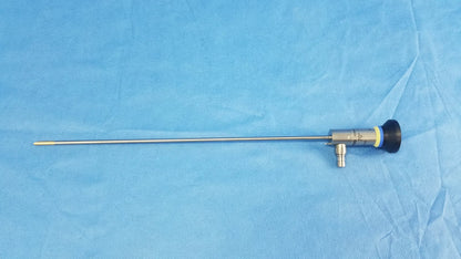 Silver oes elite wa2t470a rigid telescope with black handle and yellow accent ring designed for surgical use