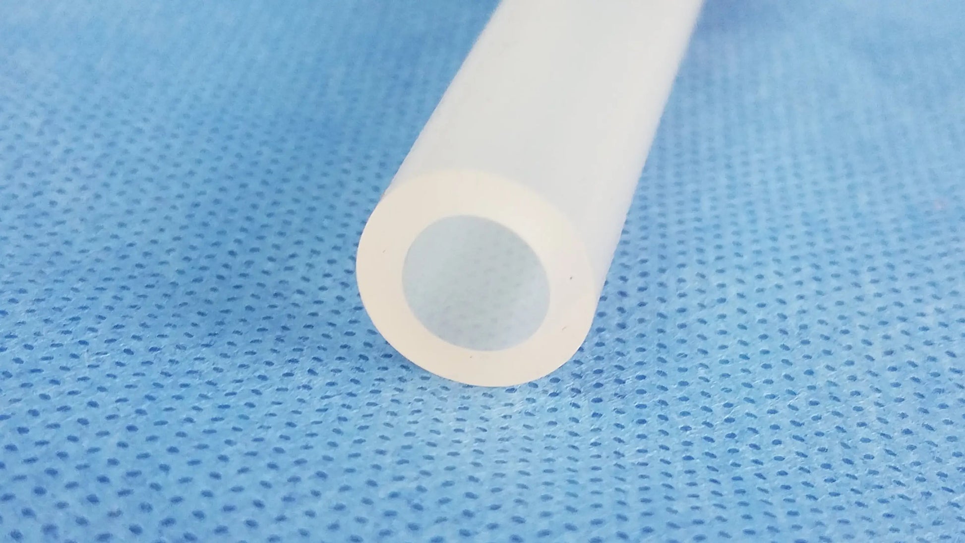 A translucent white silicone evacuation adapter compatible olympus wa33026a for connecting to the outer sheath