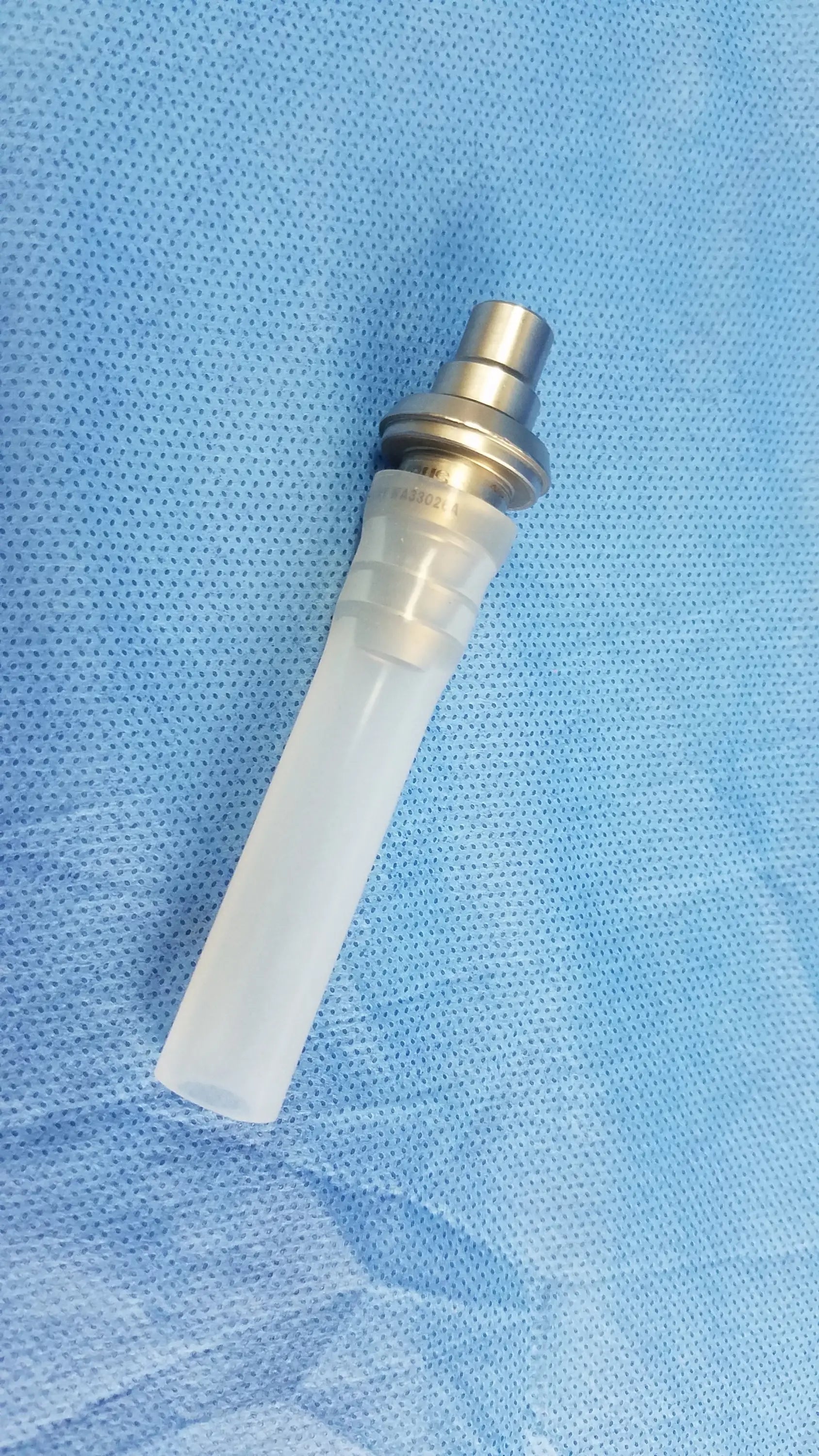 Translucent white evacuation adapter with metallic silver threaded cap compatible with olympus outer sheath wa33026a