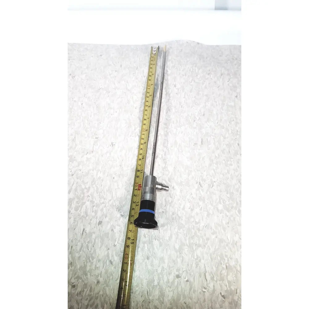 Silver olympus wa50373 autoclaveable laparoscope with black handle and blue ring featuring long slender shaft for medical use