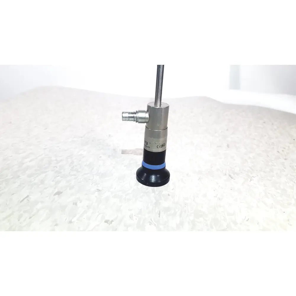 Silver and black olympus wa50373 autoclaveable laparoscope with blue ring near base for laparoscopic medical use