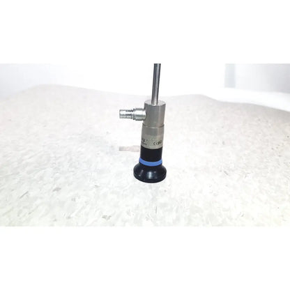 Silver and black olympus wa50373 autoclaveable laparoscope with blue ring near base for laparoscopic medical use